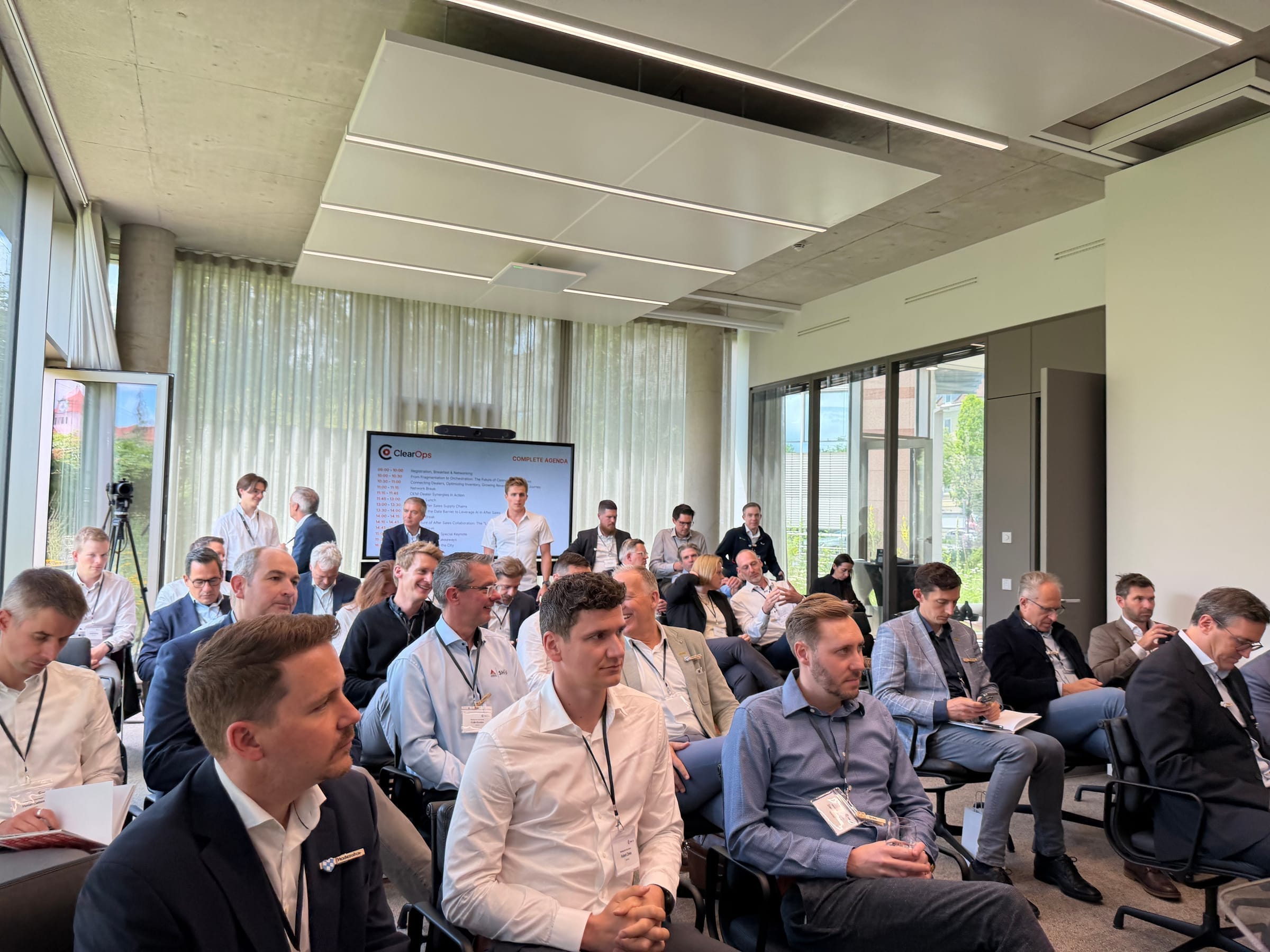 Full room of forum guests during a presentation